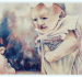 artistic painting of smiling mother holding smiling baby with cleft lip